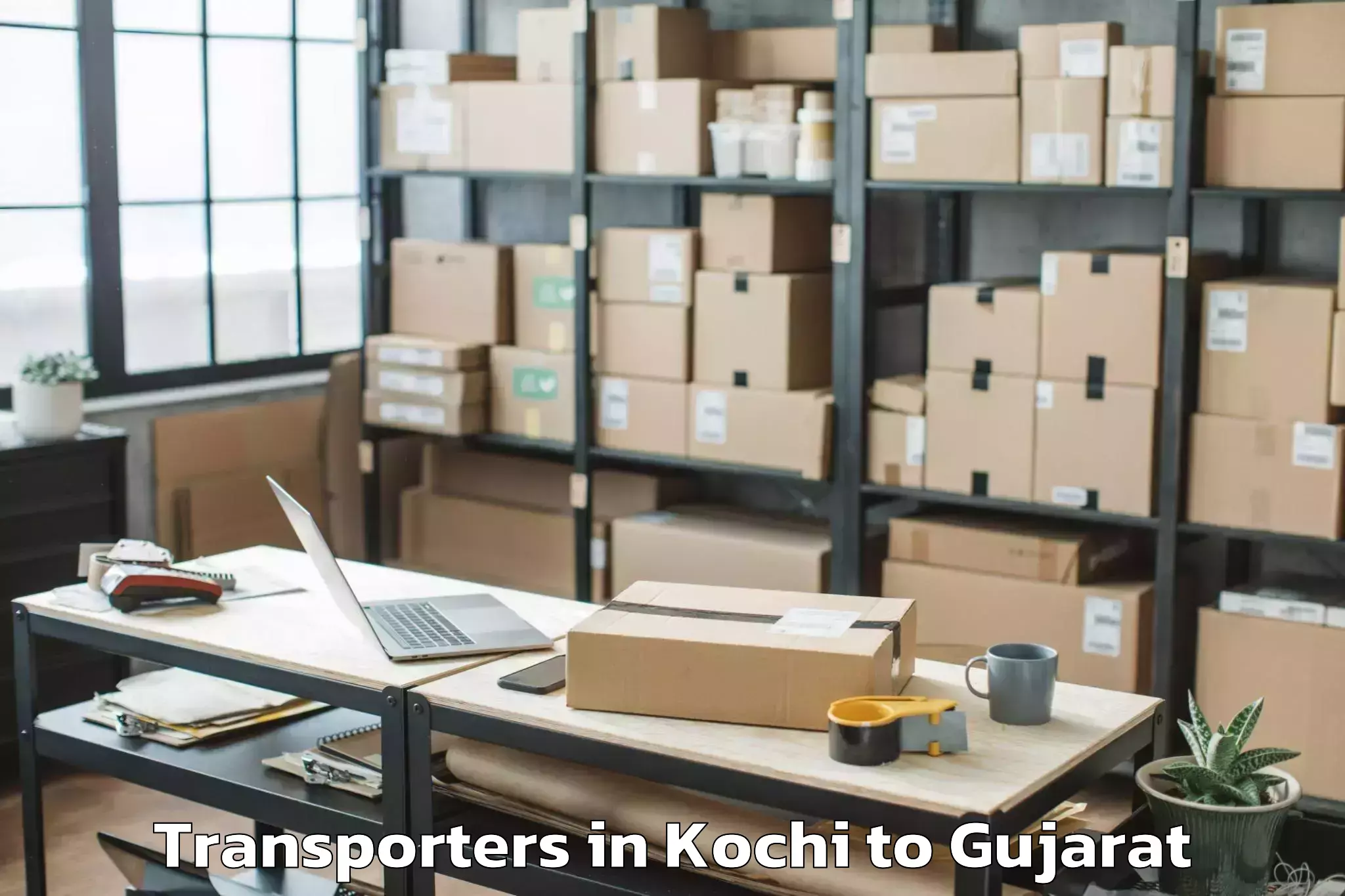 Top Kochi to Gussar Transporters Available